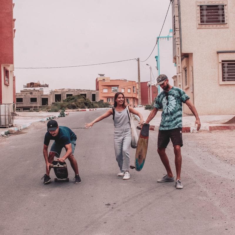 Guests heading down the village street with their skateboards