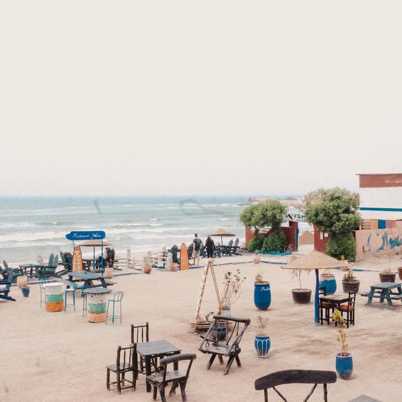 Beach cafe tables looking out over Imsouane bay
